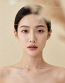 Portrait of serene young woman with flawless skin