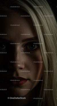 Close up portrait of woman with intense gaze and shadows