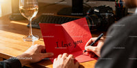 Man Writing a Heartfelt Love Note on Valentines Day