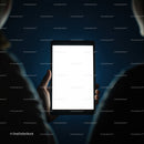 Person holding a tablet with glowing blank screen at night