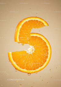 Fresh orange slice submerged in clear water droplets