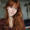 Young Woman with Red Hair and Blue Eyes in Casual Indoor Setting