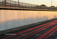City Highway with Light Trails During Sunset in Urban Environment