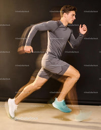 Athlete Sprinting Fast in Gray Athletic Wear