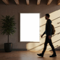 Man walking past blank poster in modern interior