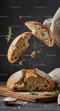 Freshly Baked Rustic Bread Breaking Apart with Herbs