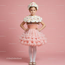 Little girl dressed as a whimsical cupcake dessert