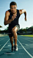 Focused Male Sprinter Exploding Off The Starting Line