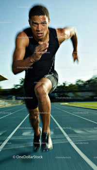 Focused Male Sprinter Exploding Off The Starting Line