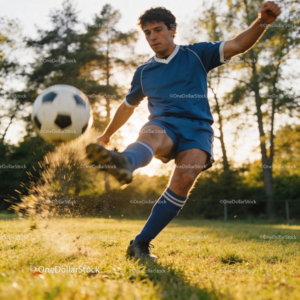 Young soccer player kicking ball on grassy field