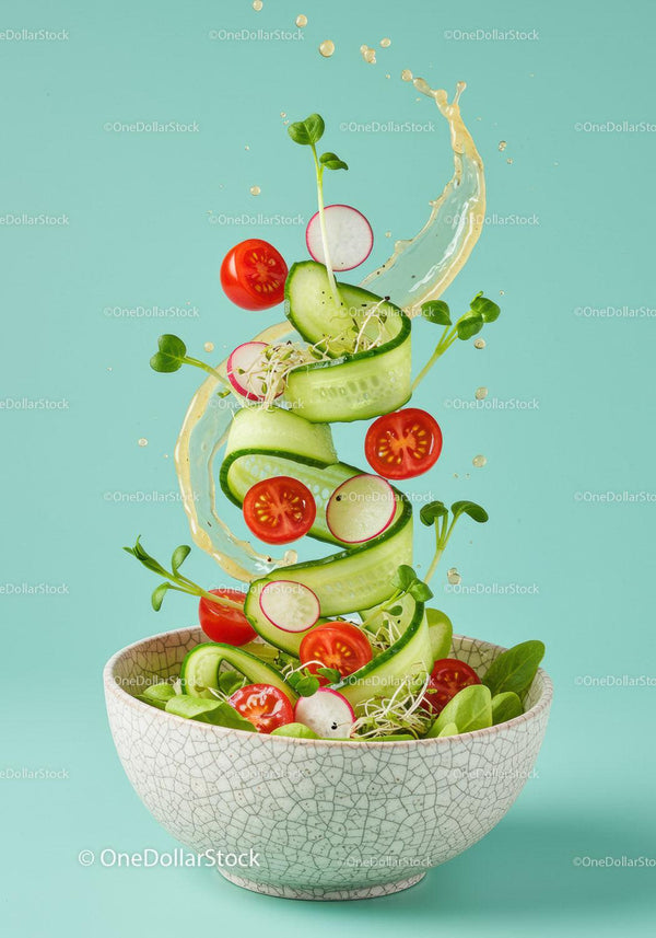 Fresh vegetable salad with cucumber ribbons and cherry tomatoes