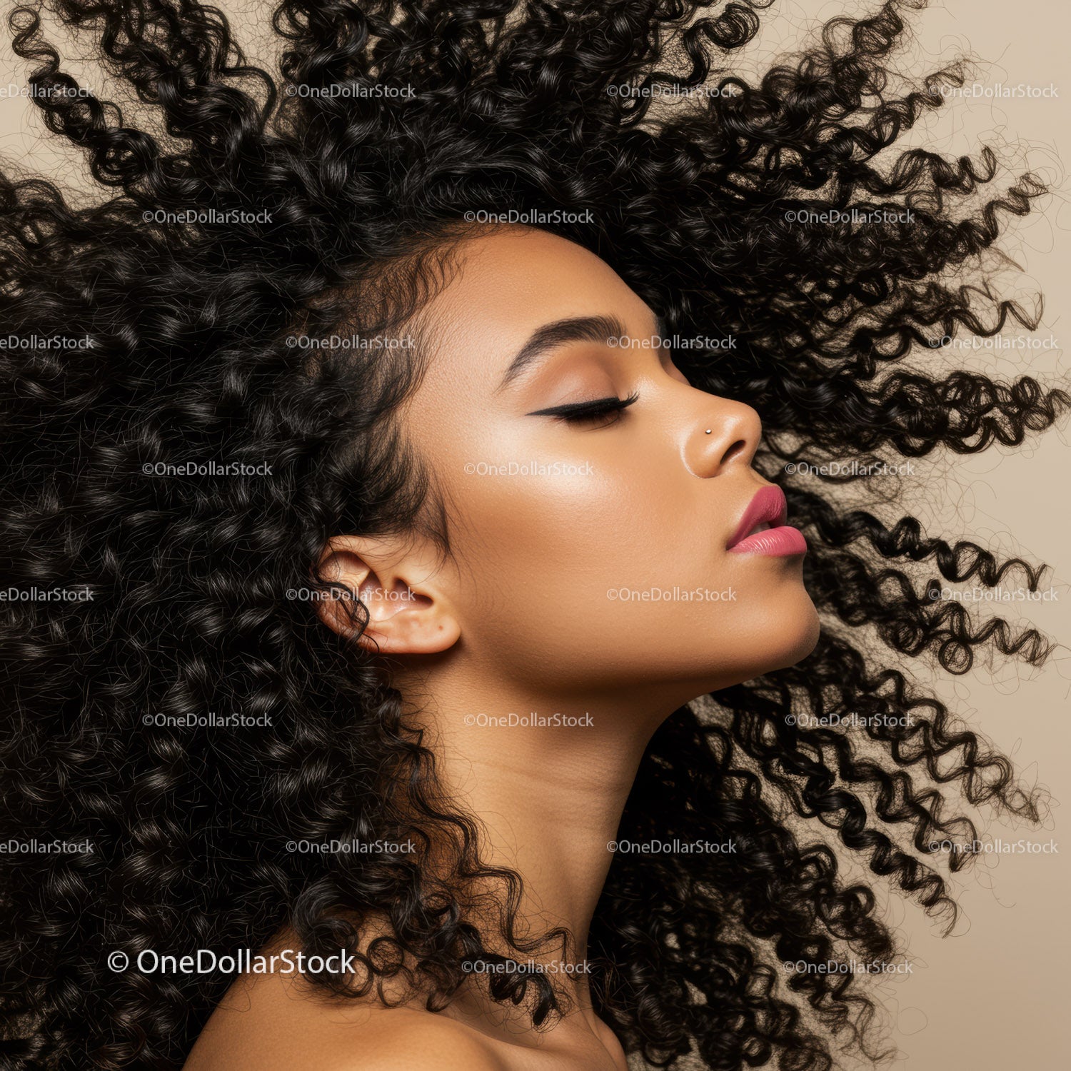 Profile of woman with voluminous curly hair and makeup