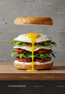 Fresh sesame bagel sandwich with fried eggs and arugula
