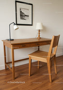 Wooden Desk and Chair with Table Lamp and Wall Art in Modern Home Office