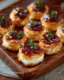Deviled Eggs with Herb Garnish and Sweet Glaze on Wooden Platter