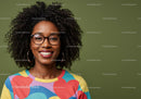 Young Woman with Glasses and Curly Hair in Colorful Shirt