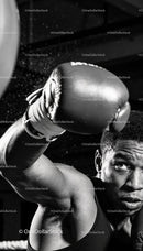 Focused boxer delivering a powerful punch in gym