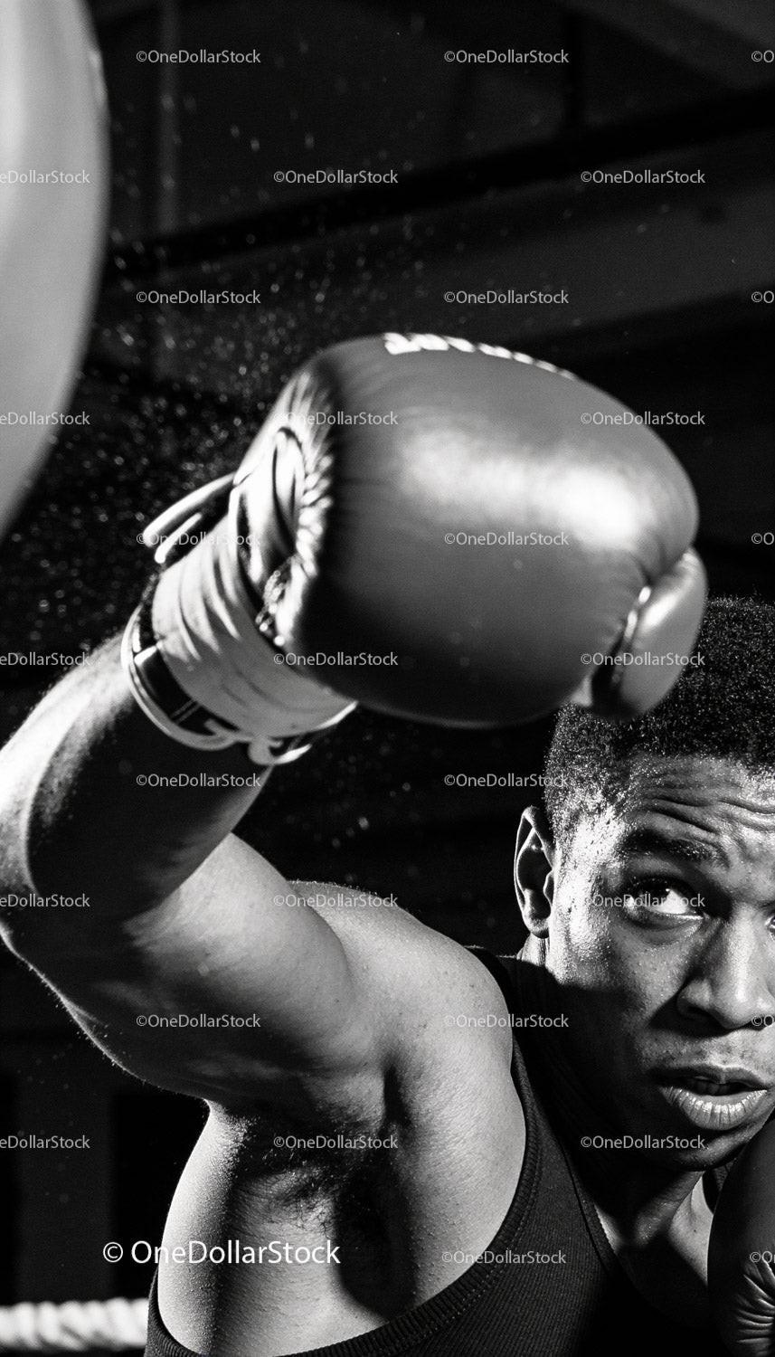 Focused boxer delivering a powerful punch in gym