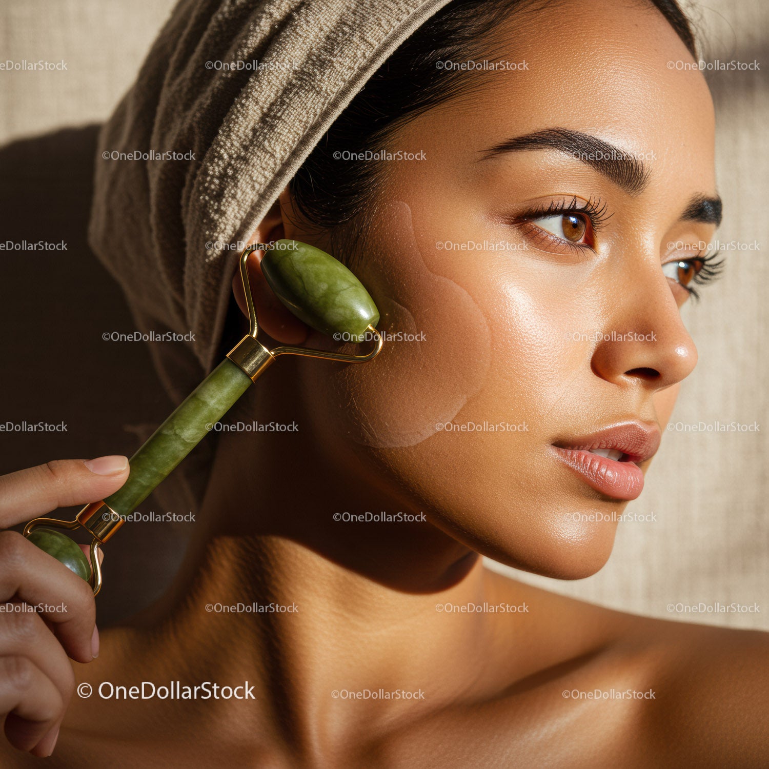 Beautiful Woman Using Jade Roller for Facial Massage and Skin Rejuvenation
