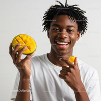 Young Man Holding Mango with Joyful Smile in Bright Studio