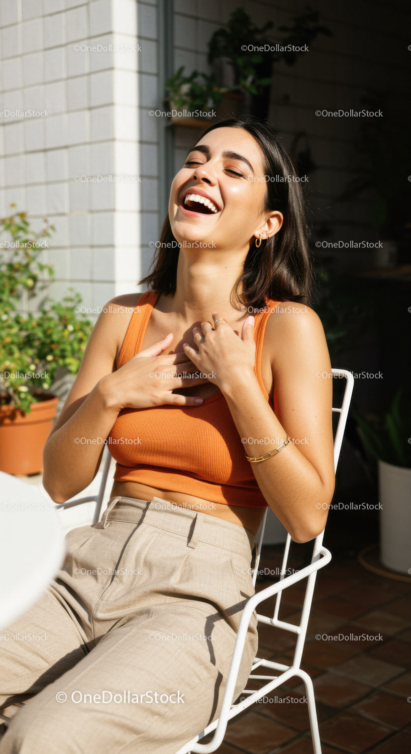 Fashionable Woman Laughing Outside in Sunlight with Urban Background