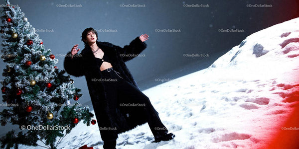 Person in Black Fur Coat by Decorated Christmas Tree