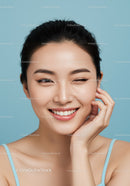 Joyful Woman with Radiant Skin Locking Eyes and Bright Smile