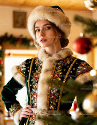 Young woman in traditional winter attire indoors