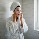 Woman Applying Facial Mask for Skincare and Wellness