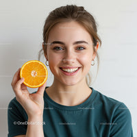 Cheerful Woman Holding Fresh Orange Slice with Bright Smile