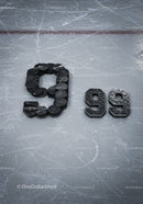 Hockey Pucks Arranged as Numbers on Ice Rink Surface