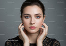 Portrait of a Young Woman with Bright Blue Eyes and Elegant Makeup