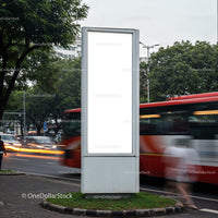 Blank urban billboard with blurred city traffic in motion