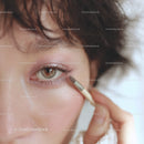 Close-up of Woman Applying Eye Makeup with Brush
