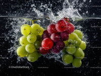 Assorted Green and Red Grapes Splashing into Water