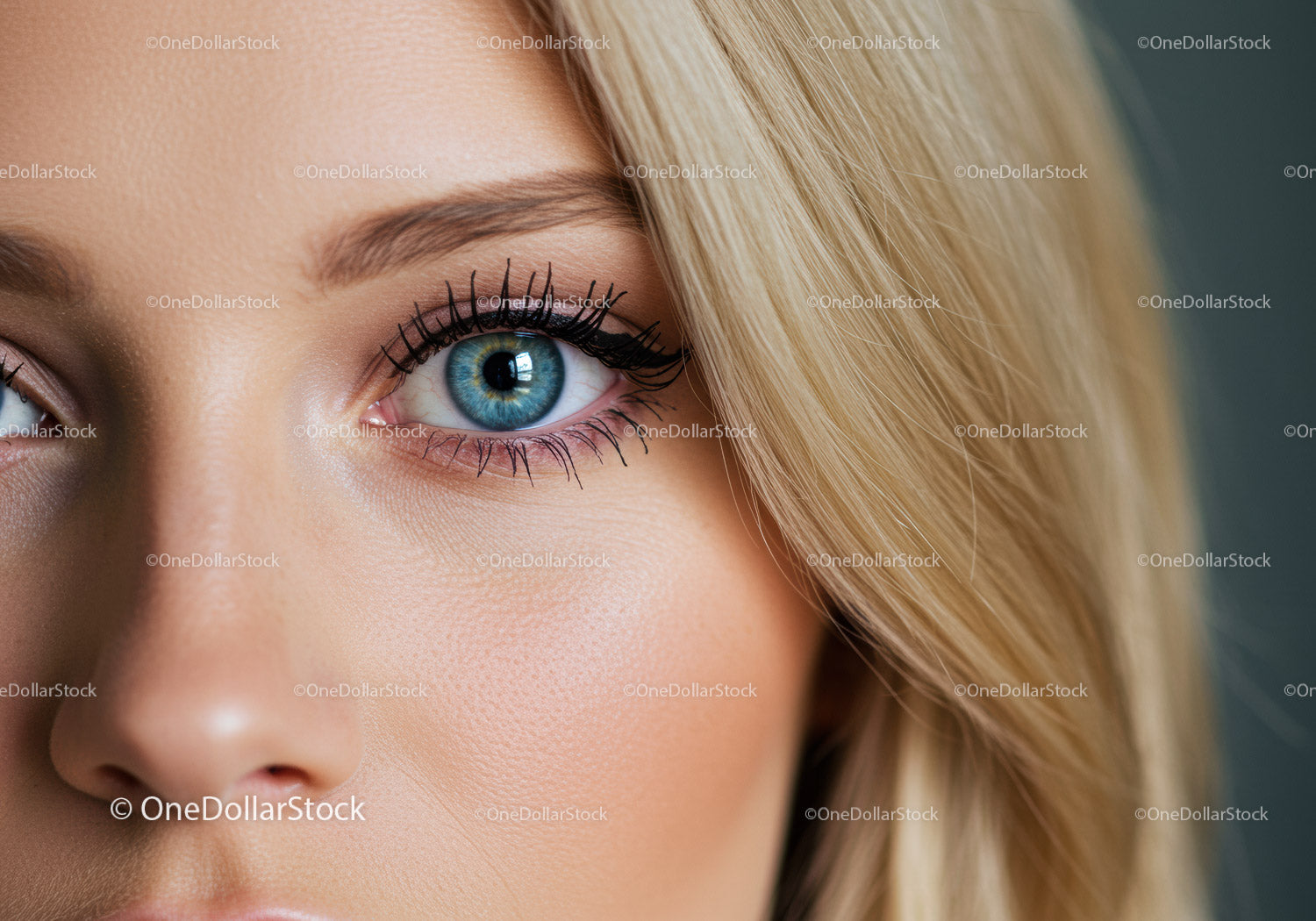 Close up of blue eye with long lashes and blonde hair