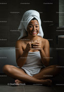 Woman with Facial Mask and Towel Wrap Relaxing in Bathroom