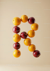 Creative letter R made from fresh fruits on beige