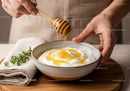 Creamy Yogurt with Honey Drizzle in Rustic Bowl on Wooden Table
