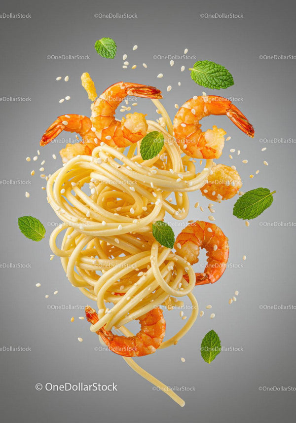 Spaghetti with shrimp, sesame seeds, and fresh mint leaves