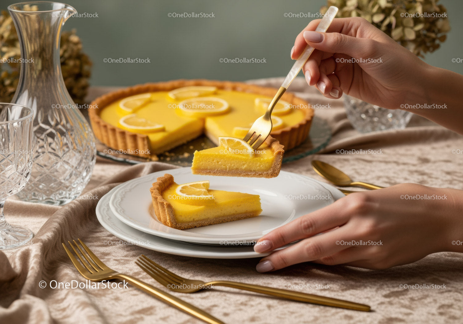 Lemon Tart with Sliced Lemons and Gold Cutlery on Elegant Table