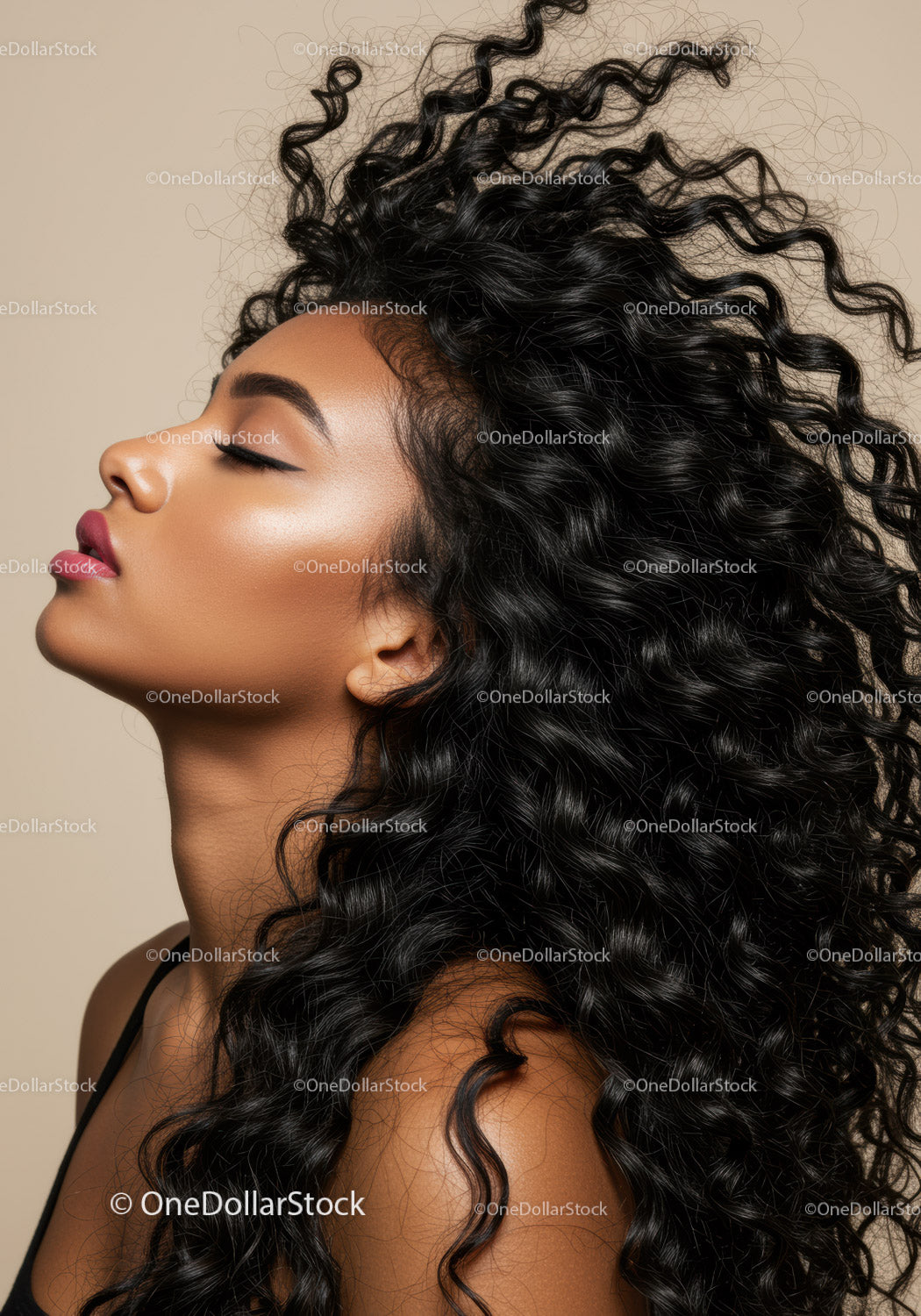 Portrait of serene woman with voluminous curly hair