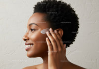 Portrait of a Woman Applying Lotion to Her Face for Healthy Skin