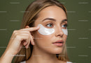 Young Woman Applying Eye Patches in Skincare Routine