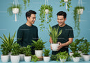 Two men enjoying indoor plants with green foliage