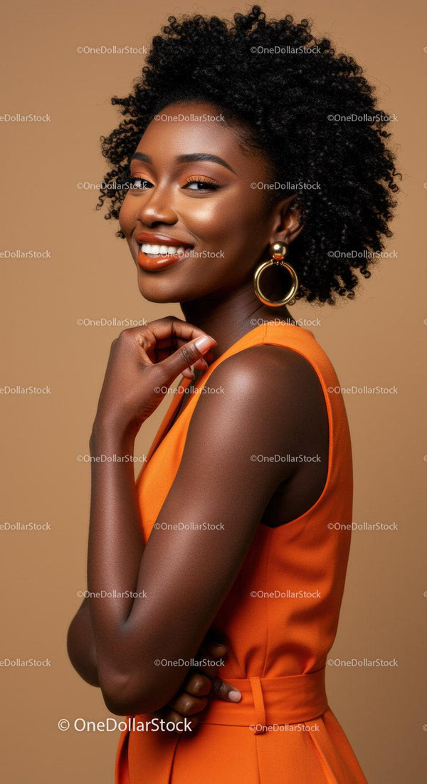 Elegant African Woman in Orange Dress with Gold Earrings Posing