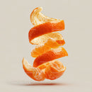 Vibrant Orange Peels Floating in Air with Bright Citrusy Appeal
