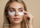 Young Woman Applying Eye Patches for Skin Care and Rejuvenation