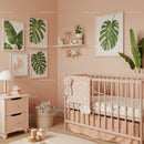 Cozy Nursery Room with Tropical Monstera Wall Art and Baby Crib