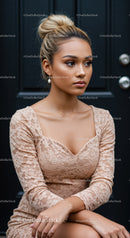 Thoughtful young woman in lace dress sitting near dark door